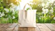© NFADLUN - Beige canvas tote bag on wooden surface outdoors
