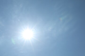 Wall Mural - bright sun on light blue sky. good weather
