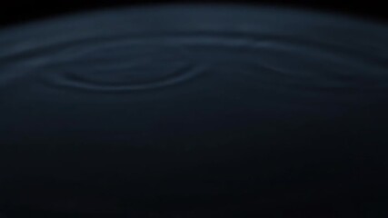 Wall Mural - subtle radial ripple effect on a dark watery surface, seamlessly looping liquid, corporate, calm