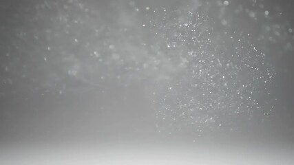 Wall Mural - subtle silver glitter particles create a soft, shimmering mist that slowly drifts in a minimalist se