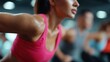 © nanskyblack - A dynamic shot of a fitness class in a gym, with people enthusiastically exercising.