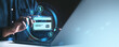 © ImageFlow - Man using credit card for online payment with digital banking icons on screen.