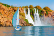 Lonely yacht sailing in the Mediterranean sea - Powerful Duden waterfall with rainbow, a water stream breaks from a high cliff - Antalya, Turkey