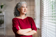 © snowing12 - Older Asian woman gazing home window contemplating life serene senior female in comfortable house peaceful moment reflection quiet indoor scene