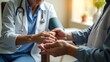 © MosammatTaslima - Doctor holding patients hand with care and compassion during a medical consultation in a clinic