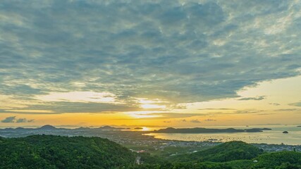 Wall Mural -  aerial hyper lapse scenery sun shines through the sky over Chalong gulf.
4K video of Majestic sunrise landscape Amazing light of nature cloudscape sky above the ocean.
colorful sky sunrise 