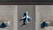 © Tohamina - Airplane on airport tarmac top view shadow visible runway taxiway