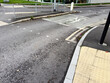 City intersection with demarcated bike lane and tactile paving in UK