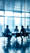 © Curioso.Photography - Silhouettes of business people in a modern glass conference room during a corporate meeting.