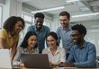 © MstShilpi12 - Diverse group of young professionals collaborating enthusiastically around a laptop sharing ideas and smiling in a bright modern workspace setting
