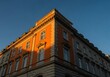 Sunlit Historic Building at Golden Hour – Warm Light on Classic Architecture