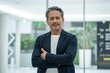 © Skyfe - CEO Headshot - Confident Middle-Aged Male, Navy Blazer, Arms Crossed