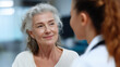 © Natali IQstock - Elderly patient talking with female doctor in hospital, empathy and care. elderly patient doctor, healthcare consultation elderly, doctor empathy hospital, senior consultation medi