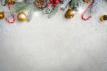 Wall Mural - christmas and new year background with fir branches with gold holiday decorations and pine cones on 