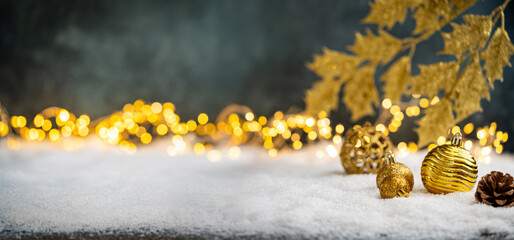 Wall Mural - christmas holiday background with snow, fir tree and decorations with christmas light behind. christ