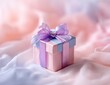 © abi - A delicate, pastel-hued gift box, adorned with a lavender ribbon bow, sits on a soft, flowing fabric background.