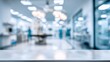 © Jane Kelly - White table surface with blurred modern medical clinic background