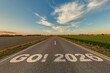 © hiv360 - numbers 2026 and start on asphalt road highway with cracks with sunrise or sunset sky background. concept of destination in future, freedom, work start, run, planning, challenge, target, new year