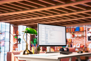 UI on PC screen in home office with programming code being executed. Coding application on computer display used by IT programmer to write and test code in modern apartment