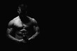 © Jale - Young Man Holding a Bomb on Black Background