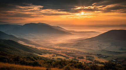 Wall Mural - Breathtaking landscape showcasing rolling hills and valleys under dramatic sunset. warm hues of orange and gold illuminate scene, creating serene and peaceful atmosphere