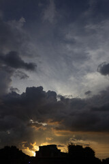 Wall Mural - Cloudscape, Colored Clouds at Sunset near the city 
