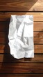 © kontolasu - Crumpled white paper on wooden planks