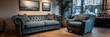 © GASTAN ALVARENDRA ST - A comfortable teal blue sofa and armchair in a stylish interior design display room, showcasing artwork and natural light.