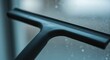 © Volha - Window squeegee cleaning glass surface