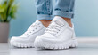 © siraphol - Stylish white sneakers with chunky sole, perfect for urban fashion and comfort