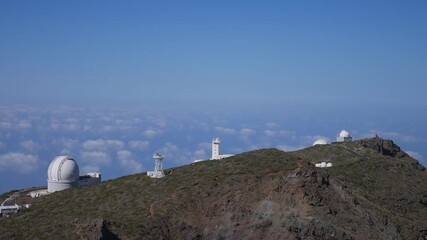 Wall Mural - Telescopes of the Roque de Los Muchachos Astrophysical Observatory above the clouds in La Palma