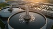 © Rehan - Vast wastewater treatment plant with circular clarifiers and aeration systems at golden hour, showcasing industrial infrastructure and environmental engineering solutions for clean water.
