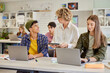 © Rido - Multiethnic students using laptop during computer class