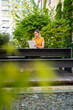 © Westend61 - Businesswoman using tablet PC on table near plants