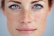 © Alina - Close-up portrait of a woman with blue eyes and freckles