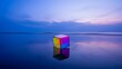 © Bhain - Colorful cube on a reflective beach under a blue sky with soft clouds at sunset