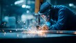 © Mishi Images - CNC laser operator checks cutting head of machine Metalworking industry process and professional equipment
