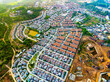 Aerial view of residential houses and driveways neighborhood during a fall sunset or sunrise time.Tightly packed homes.Top view over building houses in phuket thailand