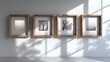 © horizon - Four identical, empty wooden picture frames hanging in a neat row on a clean white wall. Soft, natural light from the side creates gentle shadows.
