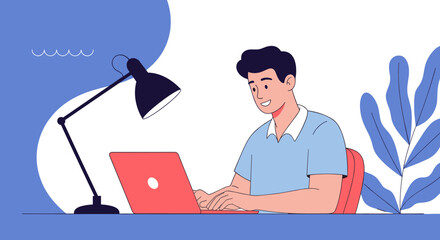 A young man happily working on his laptop at a desk with a lamp and plants. .