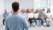 © 69 - Engaging Speaker Addressing Audience in Modern Conference Room with Bright Natural Light and Professional Atmosphere of Collaboration and Inspiration