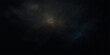 © PIXEL - Vivid blue and purple smoke billows like a cloud in the dark night sky, a bright texture against the black background