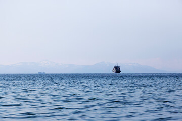 Wall Mural - ship in avacha bay in blue spring evening twilight