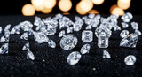 Collection of diamonds with different cuts scattered on a glittery black surface with a bokeh background.