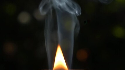Wall Mural - An extreme close-up of intricate smoke patterns swirling and dissipating from a low flame moody, magic, gas
