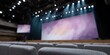 © progressman - Large stage with a purple background and a row of chairs in the foreground