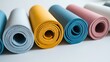 © Heorhi - Colorful yoga mats arranged neatly on a surface at a wellness center