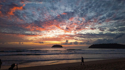Wall Mural - wilight Serenity at Kata beach Phuket. Soft hues of orange, pink, and violet spread across the evening sky, merging with the calm sea in a breathtaking panorama of tropical beauty.