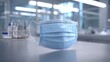 © AzSteel - Blue Surgical Mask on a Table in a Medical Environment