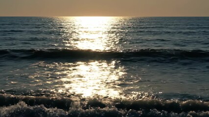 Wall Mural - Dazzling timelapse of golden sunlight dancing and glinting across the surface of gentle ocean waves, creating a mesmerizing pattern of light dazzling timelapse, environment, gentle ocean waves